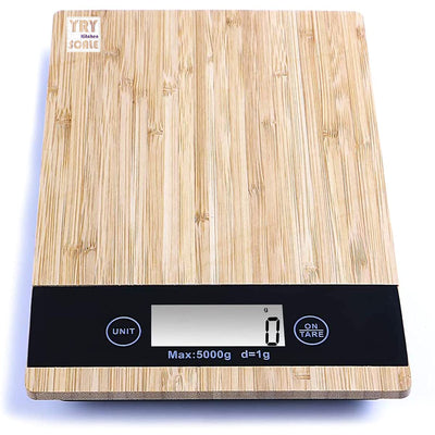 Taylor bamboo digital kitchen scale with 11 lb / 5 kg capacity, backlit LCD display, and tare function. Weighs dry and liquid ingredients in oz, g, fl oz, and ml. Eco-friendly bamboo platform.